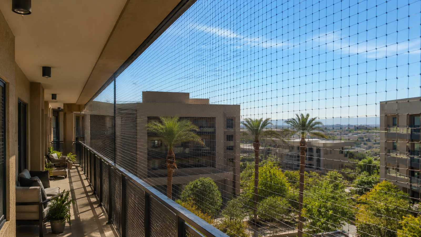 Long condo balcony protected with discreet pigeon netting