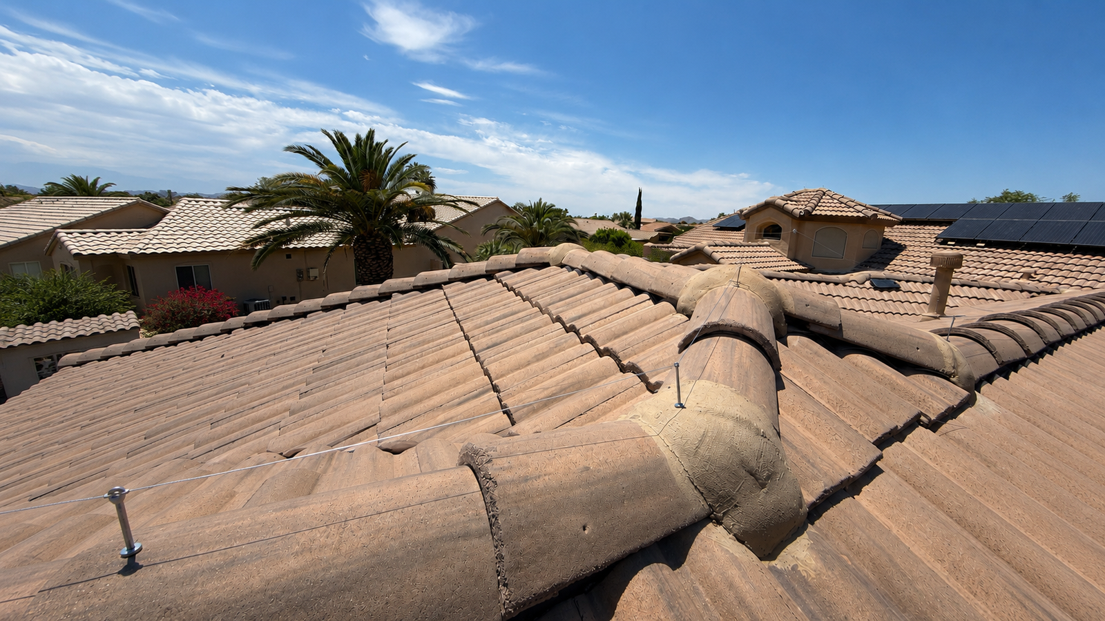 Low-profile ridgeline spider wire installed across an Arizona tile roof