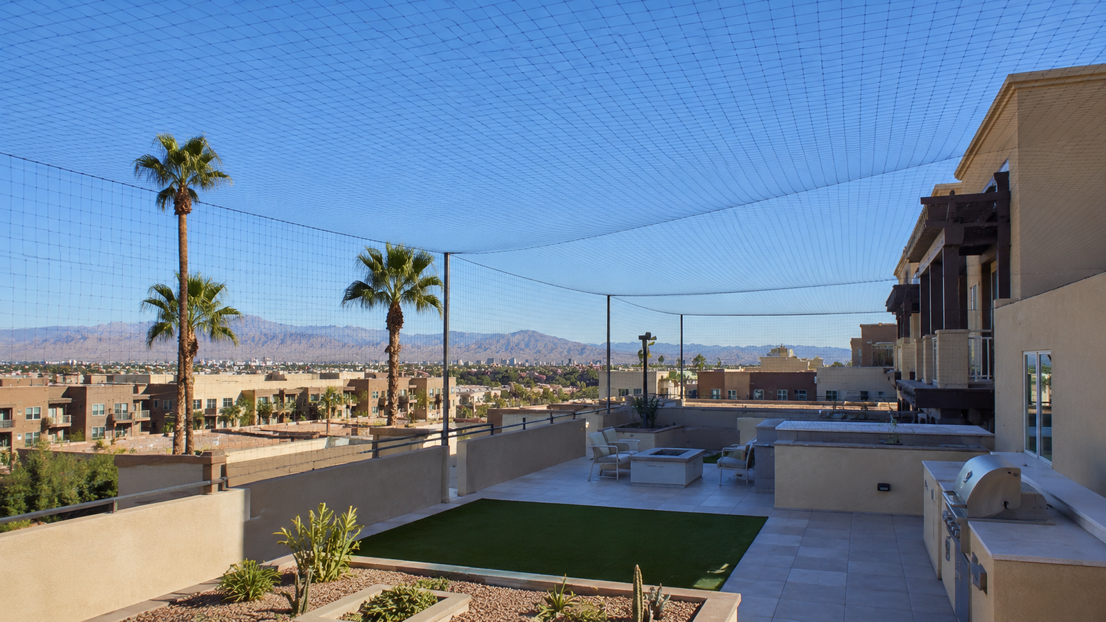 Large rooftop patio area protected with overhead pigeon netting