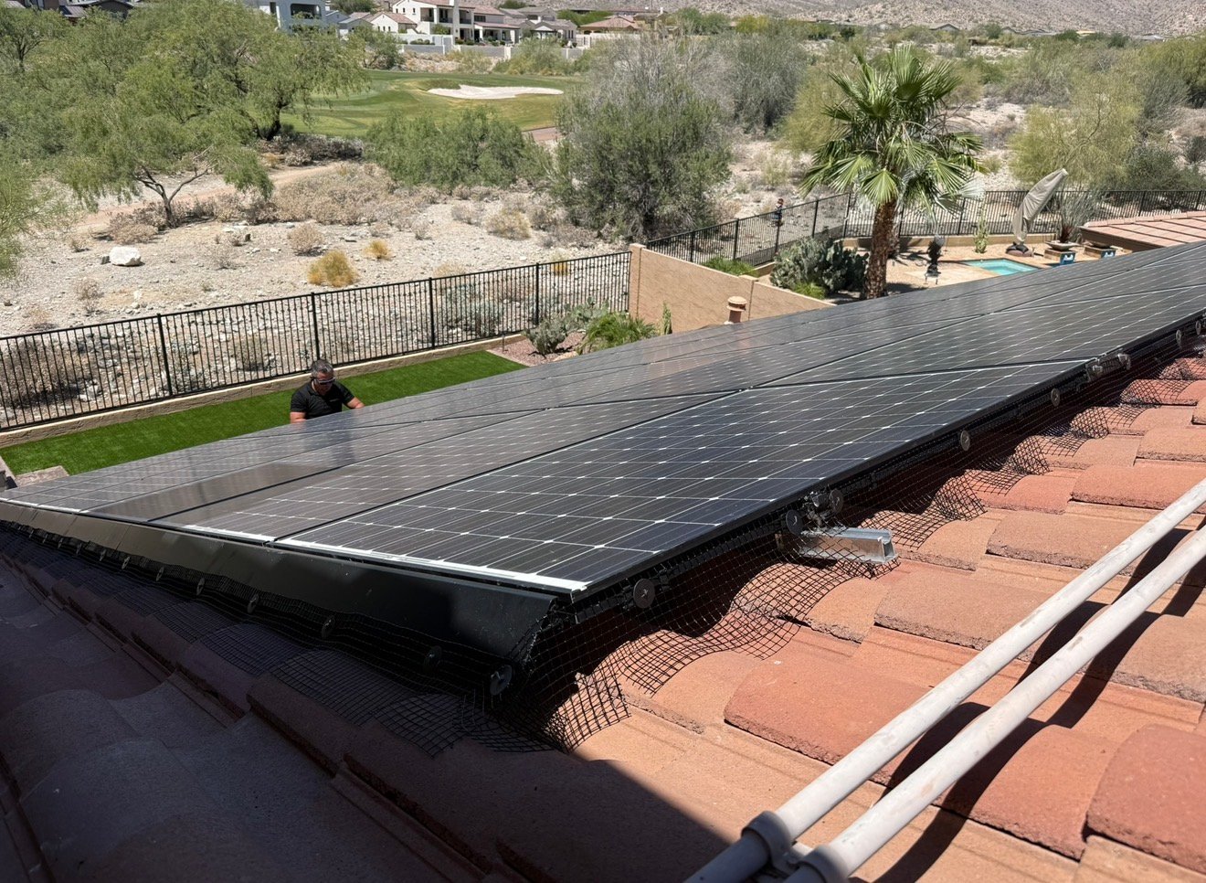 Finished solar panel mesh installed on a desert tile roof